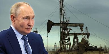 En bild på Rysslands president Vladimir Putin framför ett oljefält.