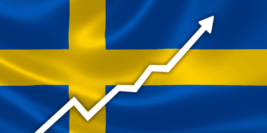 Ökande graf framför svenska flaggan